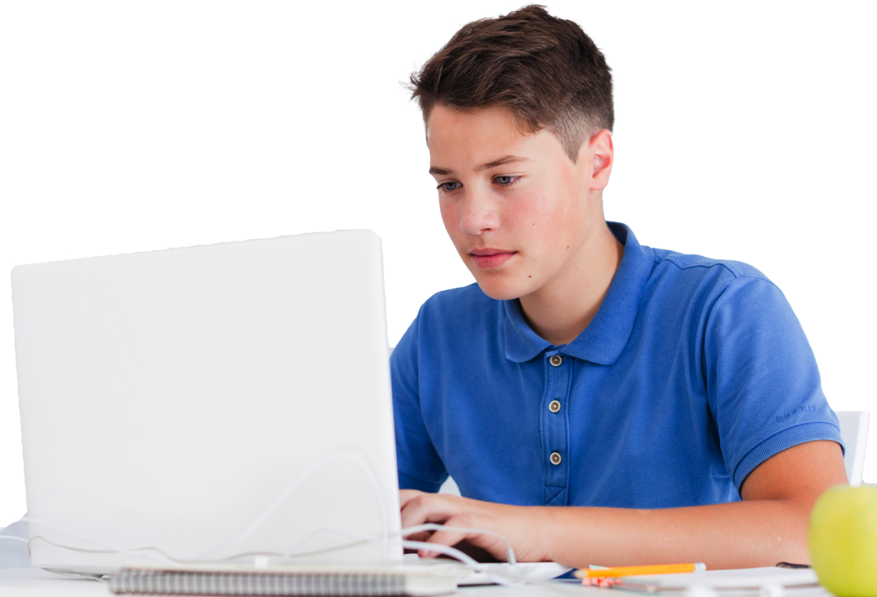 yound man sits at a desk using a laptop