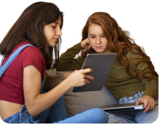 two female students sitting together looking at a tablet