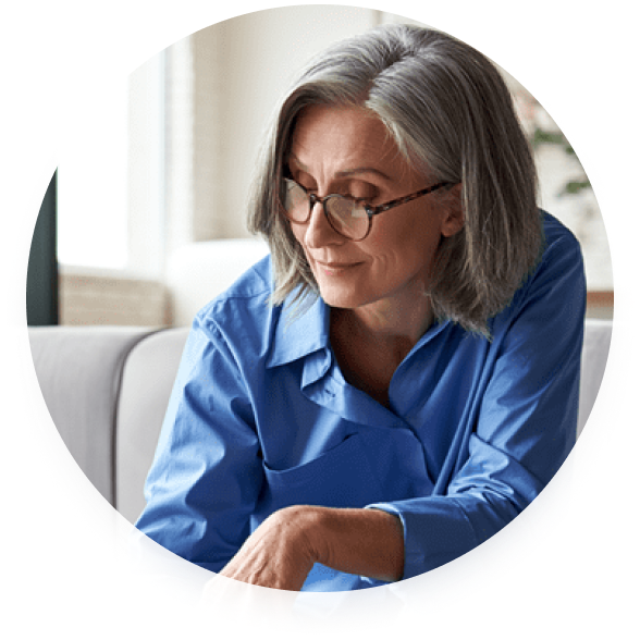 mature woman sitting on a couch